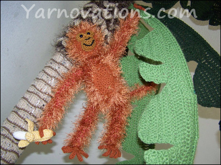 Crochet monkey, banana and palm tree