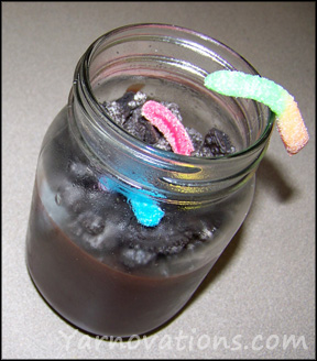 dirt and worms in mason jar