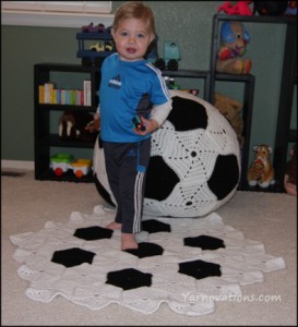 Soccer Set with baby standing on it.